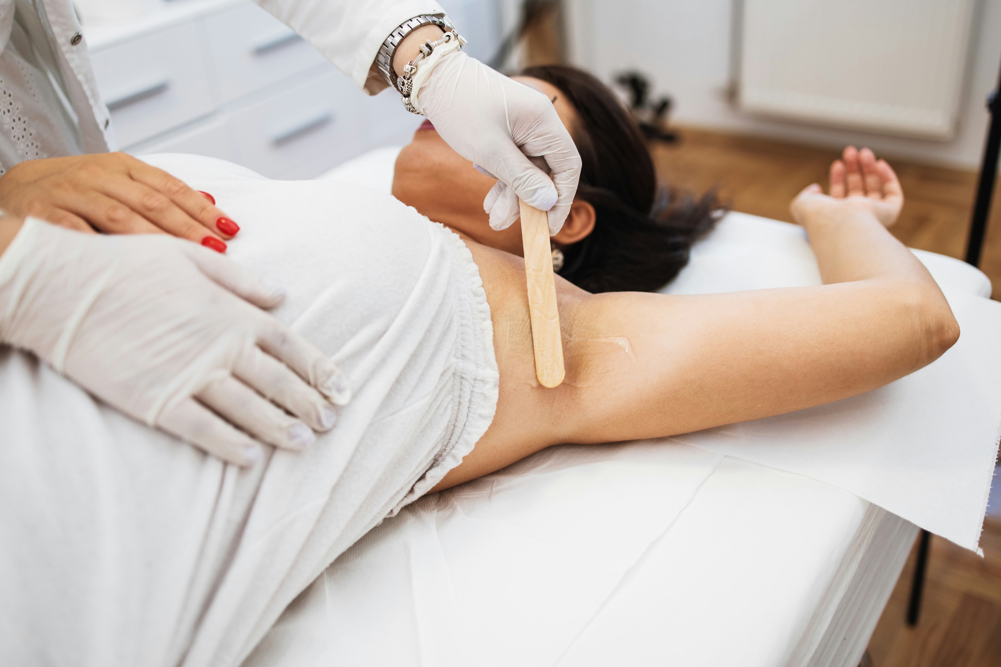 Professional arm waxing treatment at Bayshore Beauty