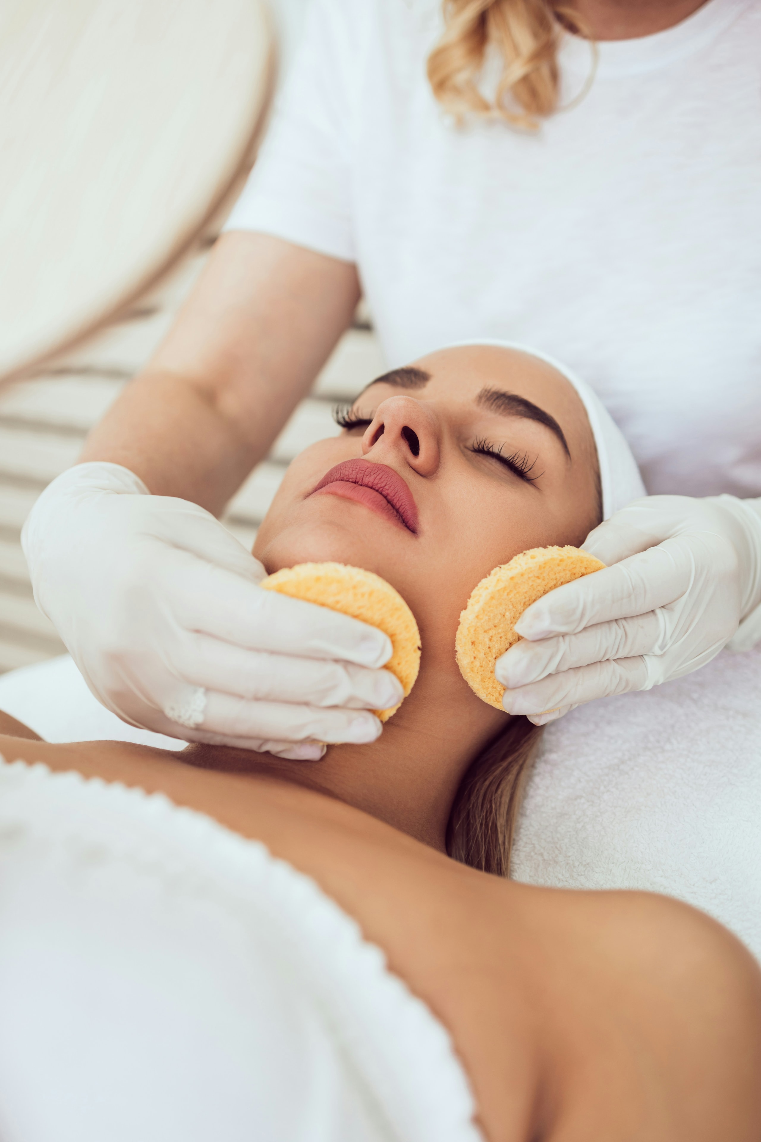 Relaxing facial treatment with warm sponges at Bayshore Beauty
